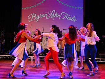 Dancers performing on stage at Byron Latin Fiesta